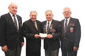 Pictured above from left: Mitch Slomiany, member of the executive, the General W. Sikorski Polish Veterans' Association; Gary Polonsky, founding president and vice-chancellor of the University of Ontario Institute of Technology; Mitch Lutczyk, president, the General W. Sikorski Polish Veterans' Association; Chester Borek, financial secretary, the General W. Sikorski Polish Veterans' Association. 