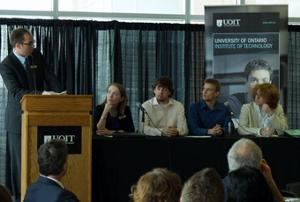 Joe Stokes, assistant registrar, Student Recruitment, addresses the panel and audience at the UOIT Educators' Luncheon, April 16 in the Business and Information Technology building.