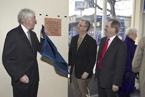 From left: Dr. Ronald Bordessa, president, UOIT, Oshawa Mayor John Henry and UOIT Board Peter Williams unveil a plaque in the Regent Theatre acknowledging the city's contribution and support of the university's expansion downtown.