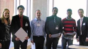 First-place winners (starting second from left): Carlson Hoang, Kevin Hogan, Prasanth Sivabaalan and Shivakanth Komatreddy. Far left: Krista Thrasher, student MC, far right: Andrew Faric, student MC. 