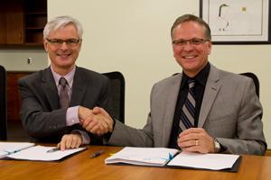 From left: President Tim McTiernan and Durham College President Don Lovisa.