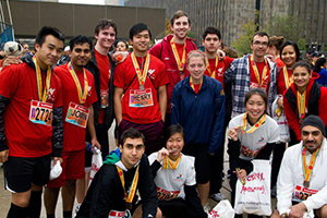 Members of UOIT's Engineers Without Borders celebrate their Run to End Poverty, at the finish line of the 2012 Scotiabank Toronto Waterfront Marathon.