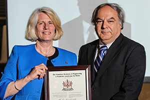 Dr. Ebrahim Ezmailzadeh (right) presented with CAE Fellowship by Kim Sturgess, past-president, Canadian Academy of Engineering.