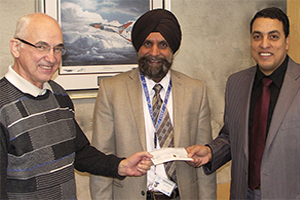 From left: Dr. George Staniewski, Ontario Power Generation; Dr. Tarlochan Sidhu, Dean, Faculty of Engineering and Applied Science (FEAS); and Dr. Atef Mohany, Assistant Professor, FEAS (images show graphic rendering of UOIT Engineering students' HPV design). 