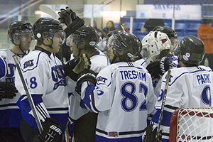 Men's hockey team celebrates OUA playoff berth after a 6-5 win over Laurier February 9 at the Campus Ice Centre; Right: Women's hockey team celebrates post-season berth February 2 after a 4-2 win in Toronto at Ryerson's Mattamy Athletic Centre.