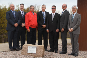 UOIT leaders and representatives of Great-West Life, London Life and Canada Life unveil dedication plaque beneath Gate to the Future sculpture (top image showing sculpture, from left: Dr. Larry Seeley, Chair, UOIT Board of Governors; Mike Murphy, Regional Director, London Life; and Dr. Tim McTiernan, UOIT President and Vice-Chancellor).