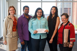 Students in UOIT's Faculty of Business and IT's (FBIT) Collaborative Leadership course present a cheque for $560 to Dr. Pamela Ritchie, Dean of FBIT. From left: Dr. Jennifer Percival, Associate Professor and Associate Dean, Programs, FBIT; Shiva Jagdeo; Fariya Khan; Amandeep Minhas; Dr. Pamela Ritchie.