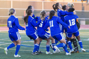 UOIT women's soccer team celebrates after OUA playoff win over McMaster at Oshawa's Civic Fields (October 23, 2013).