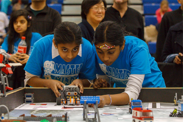 FLL teammates make final robot checks at Ontario East championships.