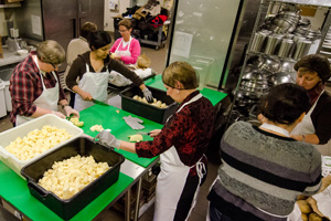 Volunteers washed, peeled and chopped vegetables to prepare enough soup to feed 720 people. 
