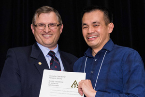 From left: Dr. Rick Caron, Chair of the CORS Practice Prize Committee, and Dr. Fletcher Lu, Assistant Professor, FBIT, UOIT.