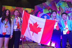 From left: Canadian students Yun Lan (Adele) Sun, Jack Kang, Bill Jia and William Wang show off their medals at the International Biology Olympiad closing ceremony. A training camp at UOIT helped them prepare for the practical component of the competition.