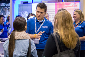 Prospective students visit UOIT booth at the 2014 Ontario Universities' Fair in Toronto.