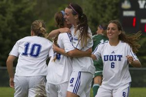Women's soccer team celebrates goal in game against Queen's at Vaso's Field. The Ridgebacks became UOIT's first-ever team to compete in a Canadian Interuniversity Sport national championship.