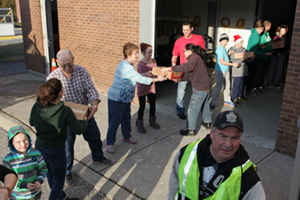 Volunteers helping load hampers onto the distribution truck for the campus Holiday Food Drive (December 21, 2014, at the Campus Recreation and Wellness Centre).