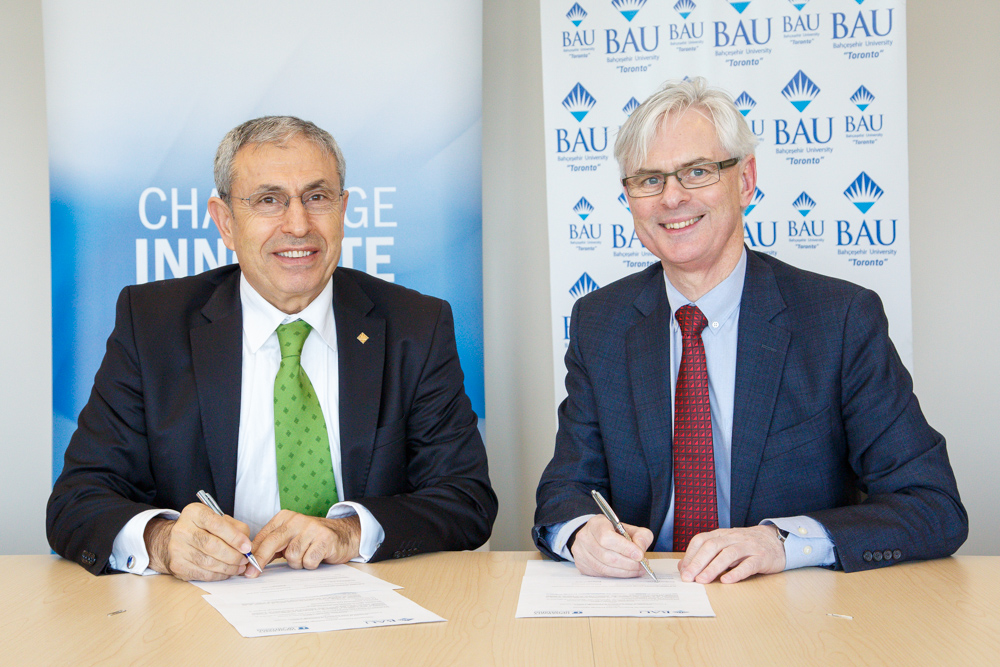 UOIT President Tim McTiernan (right) with Bahçeşehir University President Şenay Yalçın