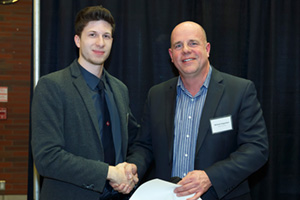 Rudy Lang, second-year Electrical Engineering student, presents Michael Angemeer, President and CEO, Veridian Corporation, with a gift of appreciation at a February recognition event. Below right: Michael Angemeer (middle) with Susan McGovern, UOIT Vice-President, External Relations and Advancement; and Tim McTiernan, PhD, UOIT President and Vice-Chancellor.