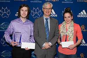 2014-2015 UOIT Scholastic Award winners Riley Therrien (left) and Katherine Koehler-Grassau (right) with UOIT President Tim McTiernan. 
