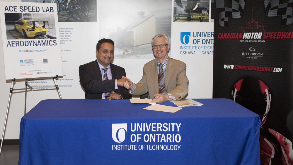 UOIT President Tim McTiernan (right) with CMS Executive Director Azhar Mohammad
