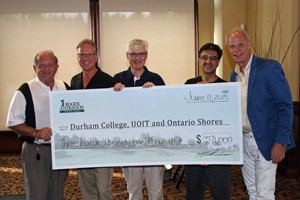 From left: Roger Anderson, Chairman and CEO, Region of Durham; Don Lovisa, President, Durham College; UOIT President Tim McTiernan, PhD; Karim Mamdani, President and CEO, Ontario Shores Centre for Mental Health Sciences; and Dan Carter, Board Chair, Ontario Shores Foundation for Mental Health, receive funds raised during this year’s Roger Anderson Charity Classic golf tournament.