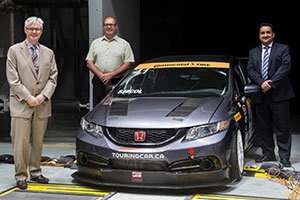 Canadian Touring Car Championship vehicle in the ACE climatic wind tunnel. From left: Tim McTiernan, UOIT President; John Bondar, CTCC President; Azhar Mohammad, CMS Executive Director.