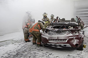 Toronto Fire Services personnel work perform an automobile extrication during a -20C blizzard inside the ACE climatic wind tunnel at the University of Ontario Institute of Technology. 