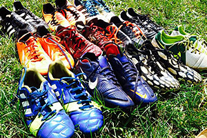 The Gulu United Football Club goes through many pairs of soccer cleats every season. Below left image, from left: Community member Victor Sateri and Jessica Mithrush, UOIT Ridgebacks women's soccer.