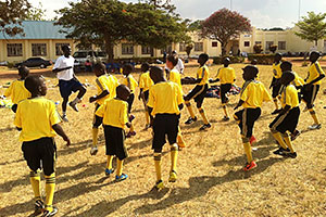 Ugandan youth playing soccer