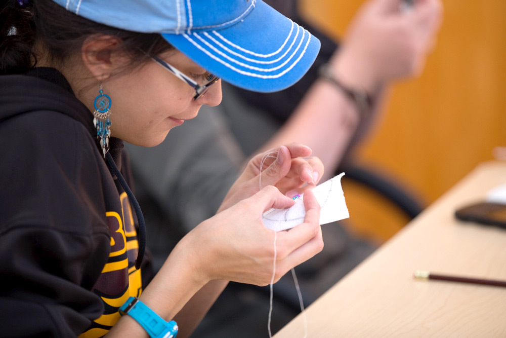 Traditional beading technique workshop during Indigenous Awareness Week 2015.
