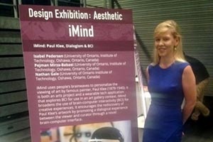 Dr. Isabel Pedersen presenting iMind at the International Symposium of Wearable Computing (ISWC) Design Exhibition in Osaka, Japan