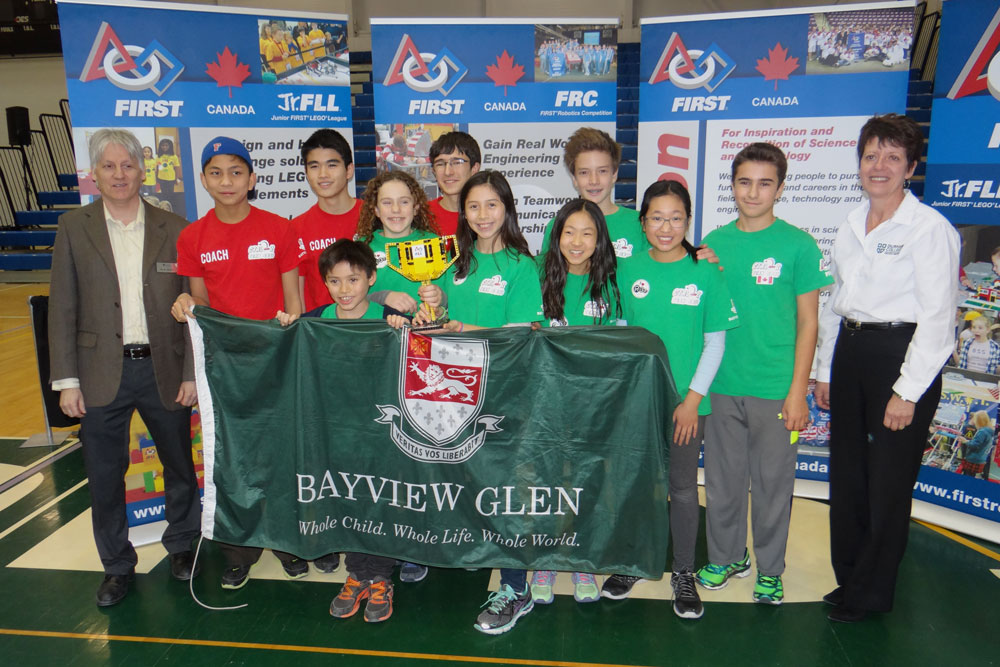 Dr. Ramiro Liscano, Associate Professor, Faculty of Engineering and Applied Science, UOIT (far left) and Susan Todd, Executive Dean, School of Science & Engineering Technology, DC (far right) with first-place winners Team Ctrl-Z from Bayview Glen School, Toronto, Ontario.