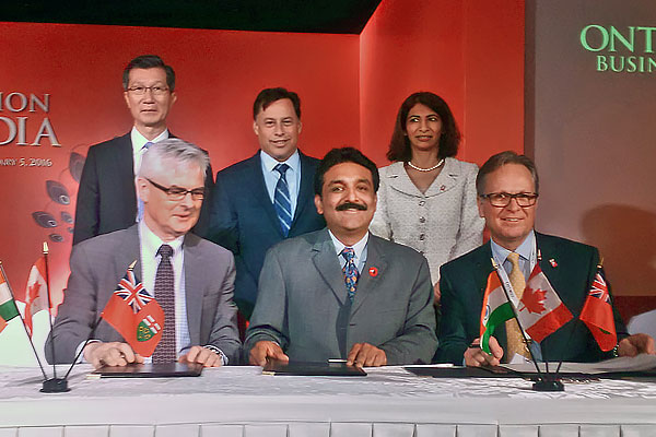 Front row: UOIT President Tim McTiernan (far left) and DC President Don Lovisa (far right) signed memorandums of understanding with Modi Edutech Chairman Alok Modi (centre) on February 1 at a ceremony in New Delhi.  Back row, from left: Hon. Michael Chan, Ontario Minister of Citizenship, Immigration and International Trade; Hon. Brad Duguid, Ontario Minister of Economic Development, Employment and Infrastructure; and Hon. Dipika Damerla, Ontario Associate Minister of Health and Long-Term Care.