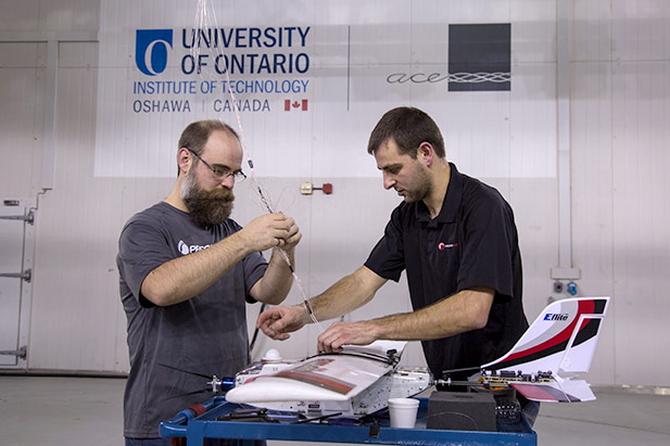 PrecisionHawk team prepares UAV for extreme-weather testing in the ACE Climatic Wind Tunnel.