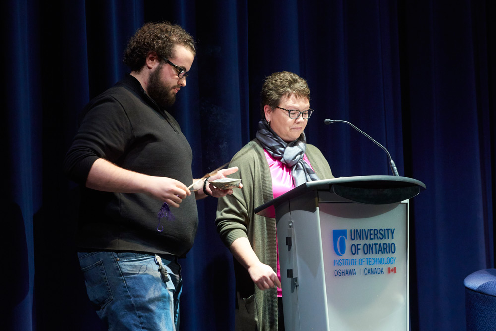 Chris Grol, Student Development Specialist, Indigenous Programming and Jill Thompson, Indigenous Cultural Advisor, UOIT-Baagwating Indigenous Student Centre (UBISC) lead the smudging ceremony.