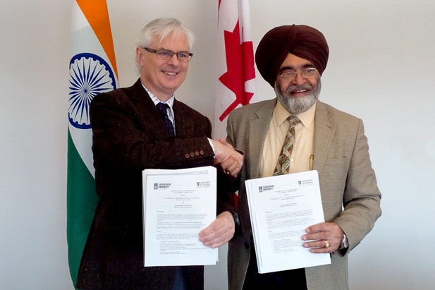 UOIT President and Vice-Chancellor Tim McTiernan (left) signs Memorandum of Understanding with Professor Rajinder Singh Bawa, Vice-Chancellor, Chandigarh University. 