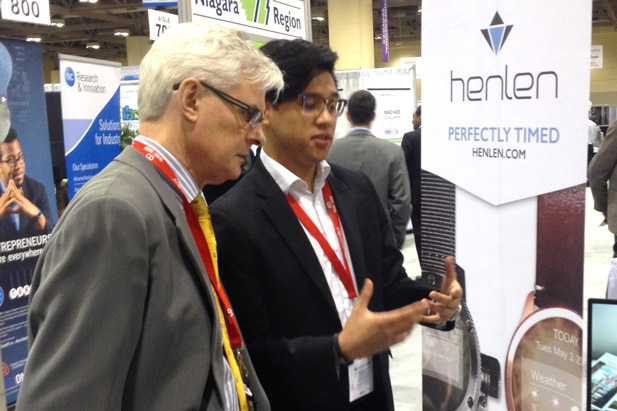 UOIT President Tim McTiernan chats with UOIT Software Engineering student Ryan Nasara (Chief Marketing Officer, Henlen Watches), at the Ontario Centres of Excellence's Discovery Days event, May 9, 2016 at the Metro Toronto Convention Centre.