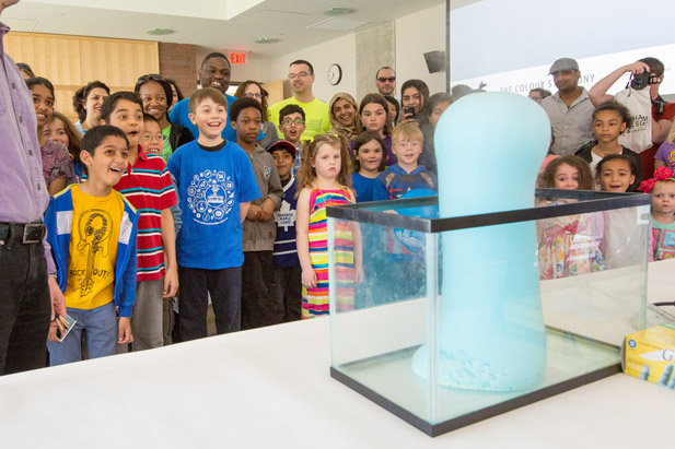 Science Rendezvous participants watch as elephant toothpaste overflows during a demonstration.