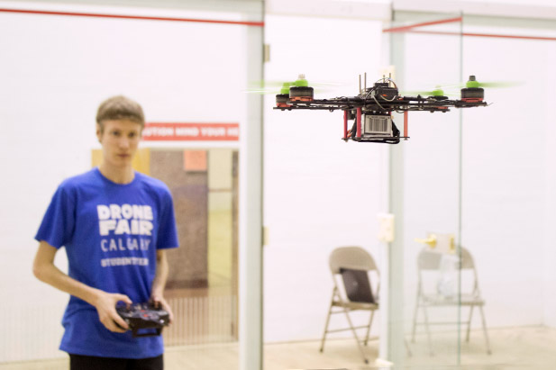 Student flying an unmanned aerial vehicle at Drone Fair Calgary on June 19.