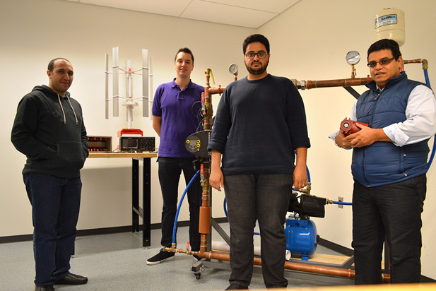 From left: Faculty of Engineering and Applied Science graduate students Ahmed Abdelrahman (PhD student) Jordan Henry (incoming Master of Applied Science (MASc) student) and Khalil Algarny (MASc student); with Dr. Mohamed Youssef, Assistant Professor (in the Power Electronics and Drives Applications Lab). 