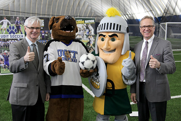 University of Ontario Institute of Technology President Tim McTiernan (left) and Durham College President Don Lovisa (right) celebrate the official opening of the Campus Fieldhouse with mascots Hunter the Ridgeback and Lord Durham (November 24, 2016).