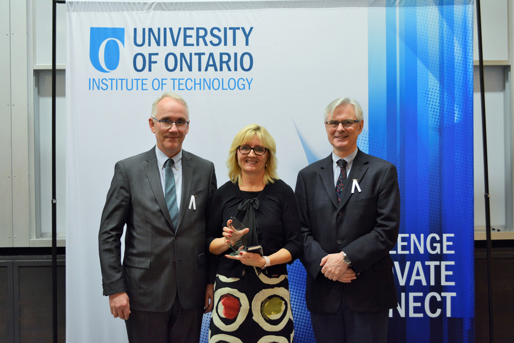 Teaching Excellence Award (Tenured and Tenure-Track Faculty): Janette Hughes, Faculty of Education  (with Robert Bailey, Associate Provost; and President McTiernan).