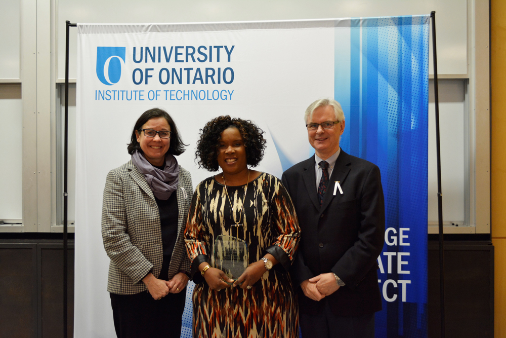 Staff Award of Excellence (Professional/Manageriall): Ade Oyemade, Office of the Registrar (with Deborah Saucier, Provost and Vice-President, Academic; and President McTiernan). 
