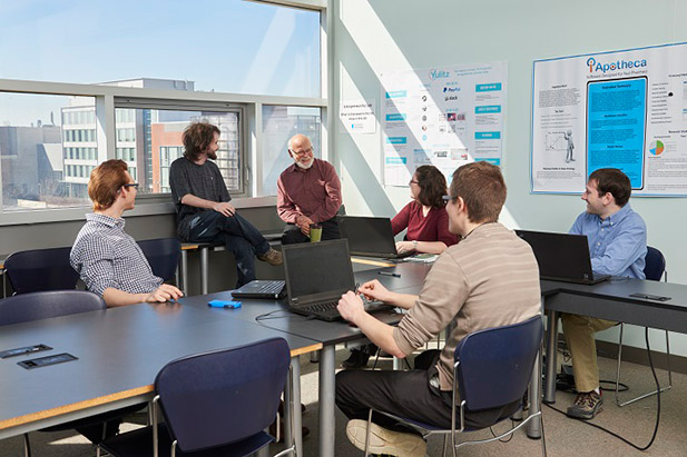 Students in the Entrepreneurship program discuss strategy in the Business and Information and Technology Building at the university's north Oshawa location.