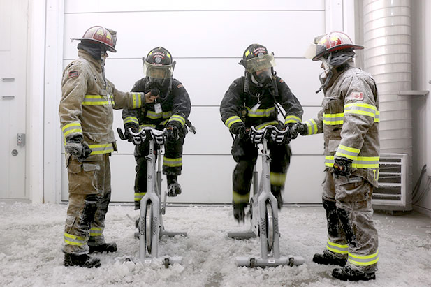 Students from the Pre-Service Firefighter program at Durham College take part in an Environmental Stress Workshop inside one of the University of Ontario Institute of Technology's ACE climate chambers.