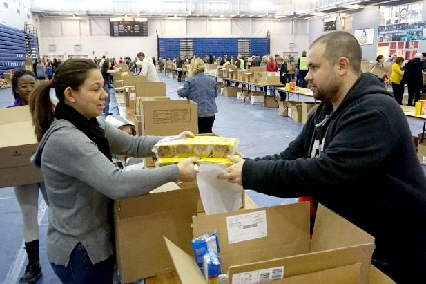 Volunteers packed and delivered hampers on December 18.