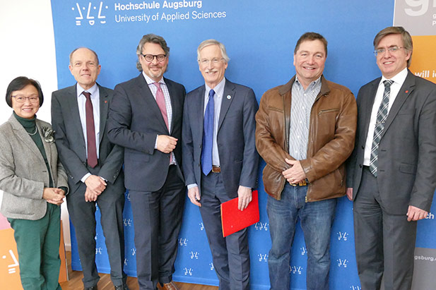 Signing ceremony between the University of Ontario Institute of Technology and the Augsburg University of Applied Science in Augsburg, Germany (January 30, 2017). The university is represented by Michael Owen, PhD, Dean, Faculty of Education (fourth from left) and Doug Holdway, PhD, Interim Vice-President, Research, Innovation and International (second from right).
