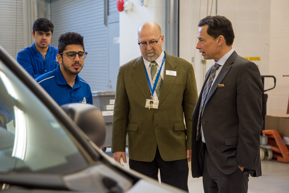 The Honourable Brad Duguid, Minister of Economic Development and Growth chats with John Komar, Director, Engineering and Operations, ACE during campus visit on March 15, 2017.