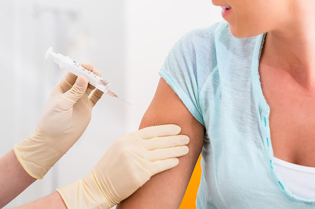 Photo of woman getting vaccinated