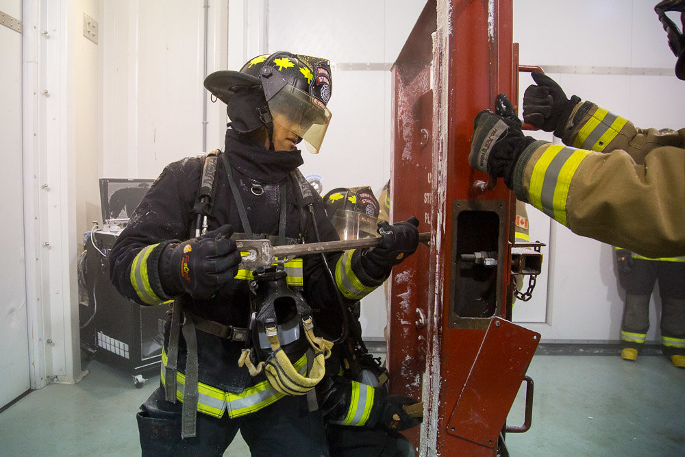 Firefighter students practiced forced-entry techniques at the ACE Firefighter Environmental Stress Workshop.