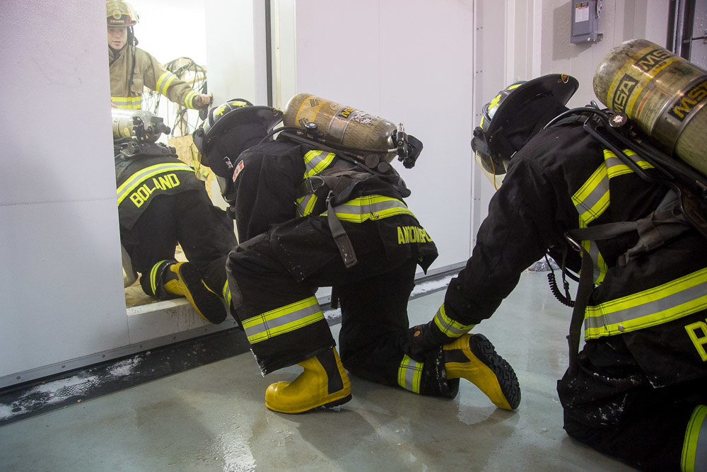 Firefighter students wore full self-contained breathing apparatus (SCBA) gear as they navigated through the heat maze.